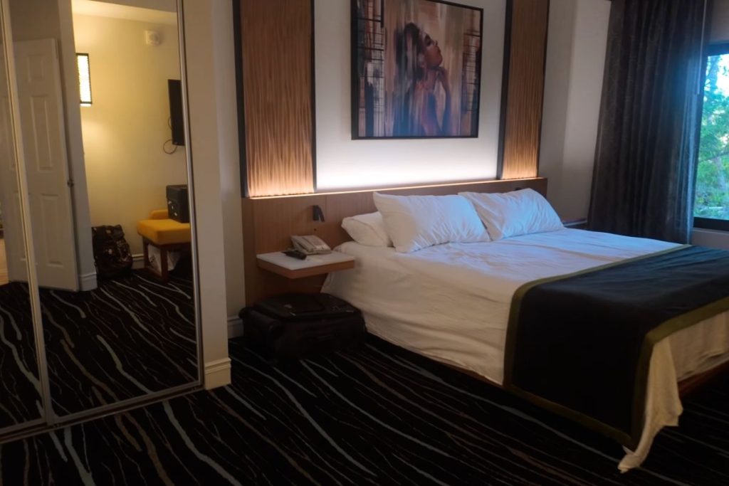 The bedroom in our room with white sheets.